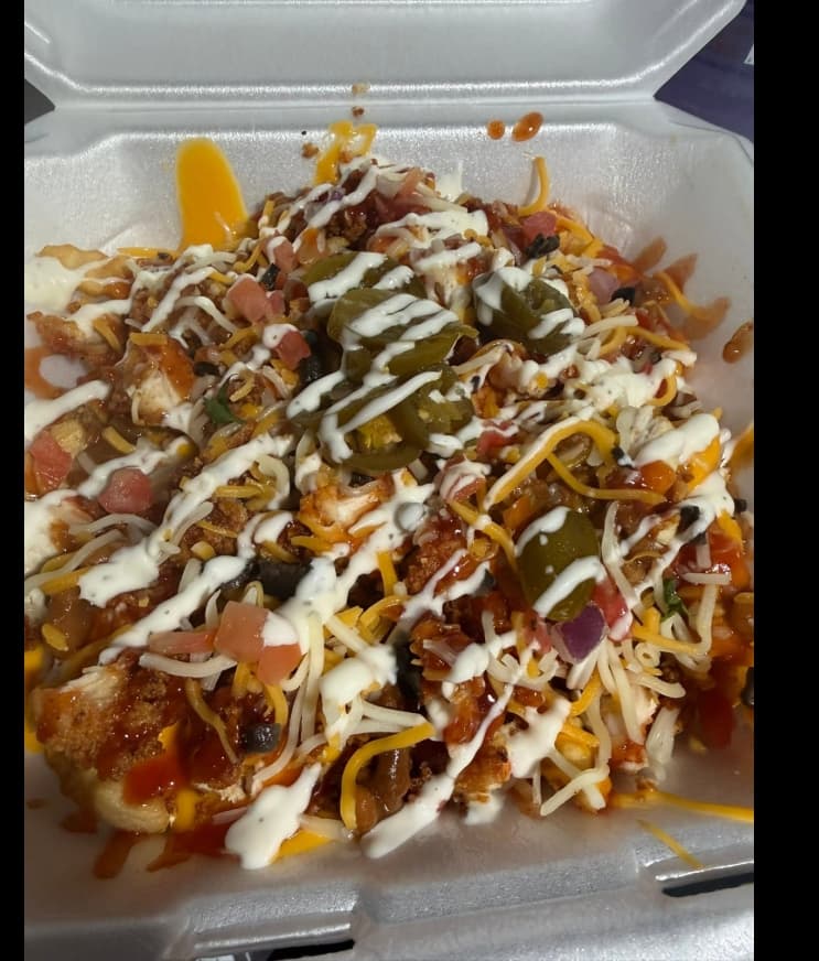 Loaded fries with fried chicken, cheese, jalapeños, ranch, and buffalo sauce